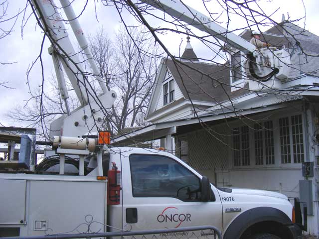 The Oncor guy...hooking up our new service riser.