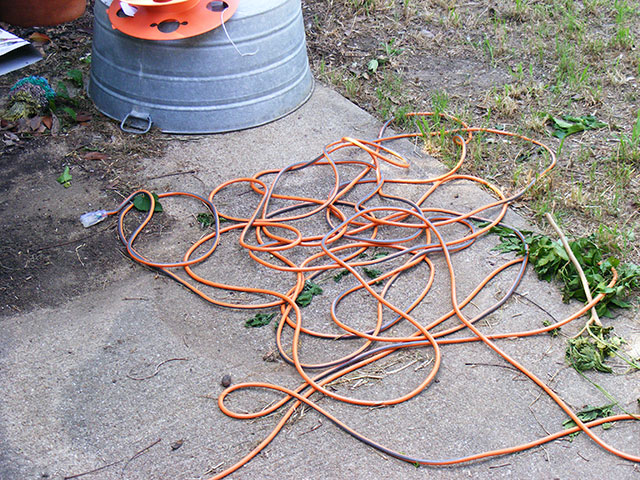 New 100-foot heavy (14ga) extension cord). Cost more than the saw!