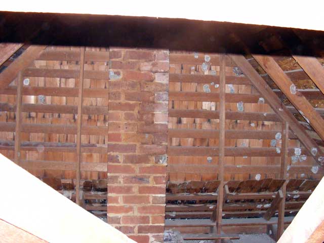 More kitchen attic...showing the old stove chimney.
